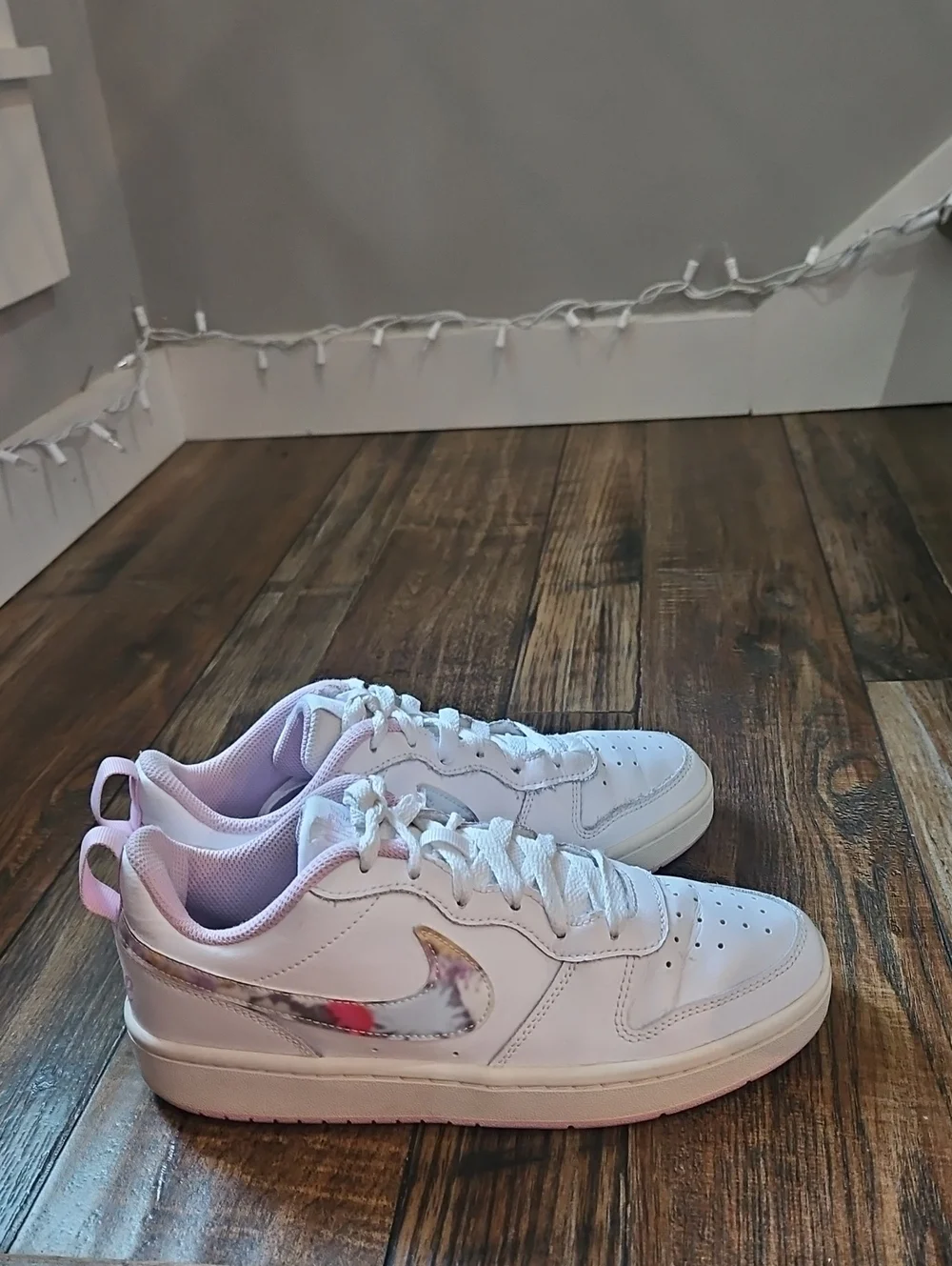 Nike White Low-Top Sneakers with Marbled Swoosh and Pink Details
